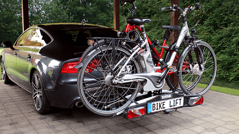 Car with E-bike carriers